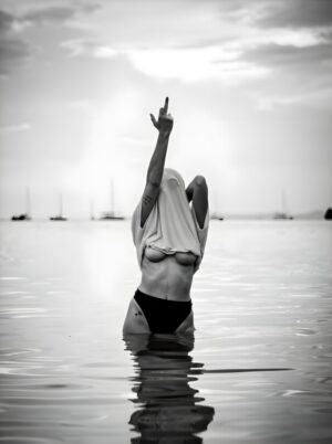 In the Water, middle finger, surreal, modern photography, ocean, water, minimalism, black and white, nude, rebellious, contemporary, conceptual, woman, women
