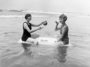 Tea Party on a Raft, tea party, beach, ocean, vintage photography, black and white, women, whimsical, seaside, teacups, humorous, summer