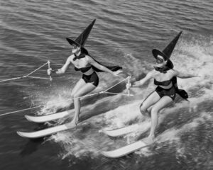 Water Skiing Witches, witches, water skiing, halloween, vintage photography, black and white, costumes, humorous, surreal, whimsical, lake, retro, women