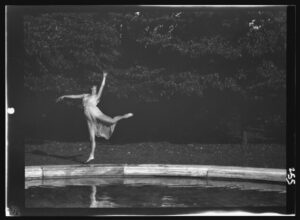 Elizabeth Duncan dancers by Arnold Genthe, Dancer by the Reflecting Pool, modern dance, solo dancer, ballet, movement, reflection, pool, vintage photography, grace, performance, outdoors, black and white